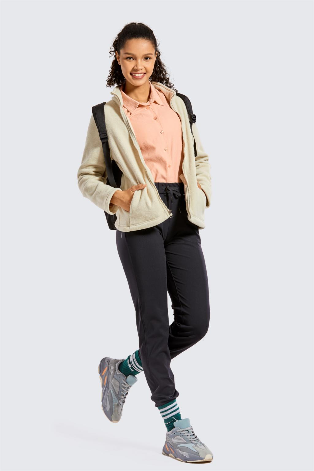 A pair of women's stretch lounge sweatpants in a stylish design, featuring a drawstring closure and pockets, perfect for travel and athletic training.