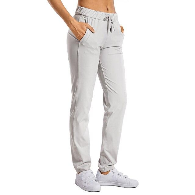 A pair of women's stretch lounge sweatpants in a stylish design, featuring a drawstring closure and pockets, perfect for travel and athletic training.