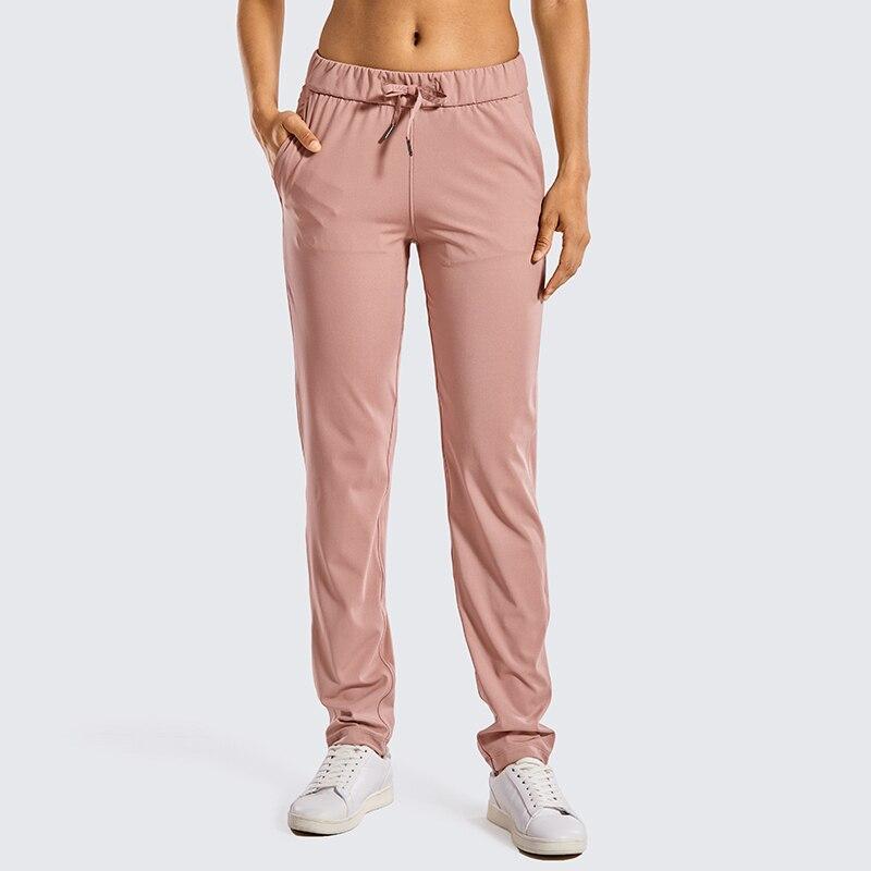 A pair of women's stretch lounge sweatpants in a stylish design, featuring a drawstring closure and pockets, perfect for travel and athletic training.
