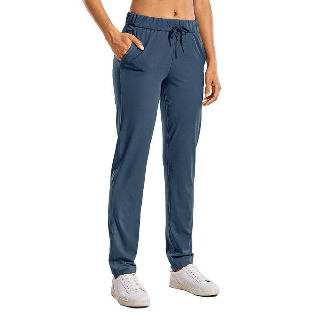 A pair of women's stretch lounge sweatpants in a stylish design, featuring a drawstring closure and pockets, perfect for travel and athletic training.