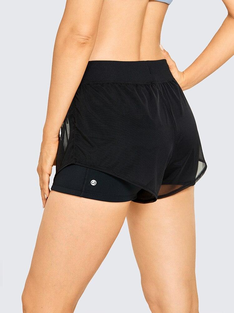 A pair of women's 2 in 1 workout running shorts featuring a quick-dry liner, elastic waistband, and a small pocket, designed for comfort and performance.