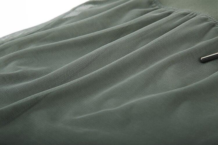 A pair of women's 2 in 1 workout running shorts featuring a quick-dry liner, elastic waistband, and a small pocket, designed for comfort and performance.