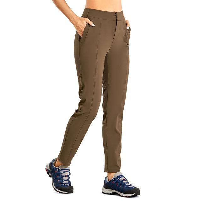 A pair of Women's Zip-off Hiking Pants in various colors, showcasing their lightweight and quick-drying fabric, with zip-off legs for versatility.