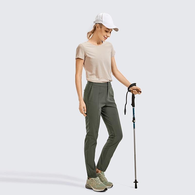 A pair of Women's Zip-off Hiking Pants in various colors, showcasing their lightweight and quick-drying fabric, with zip-off legs for versatility.