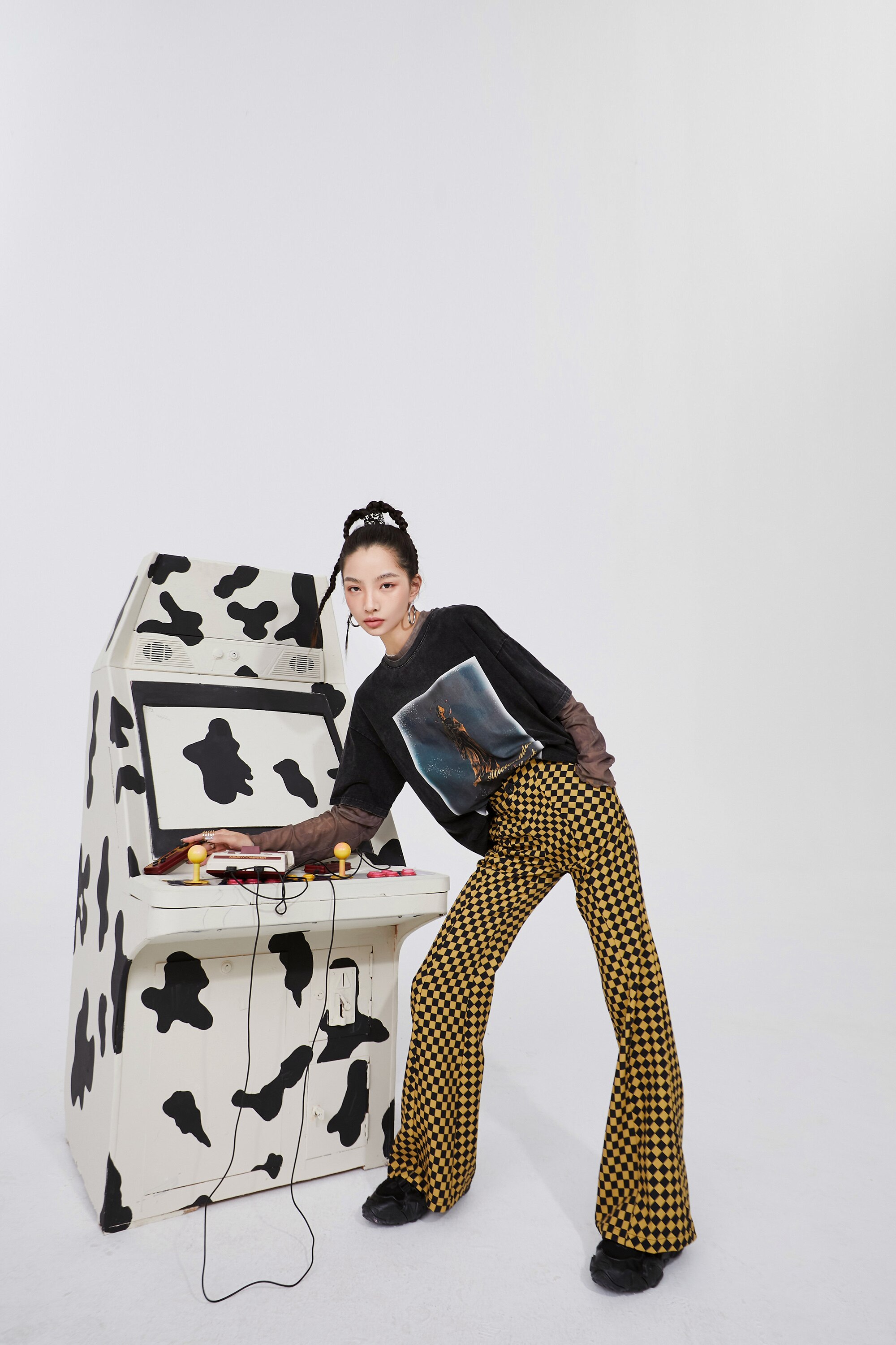 A pair of stylish yellow plaid high waist casual women flare pants, showcasing a chic design suitable for spring and autumn wear.