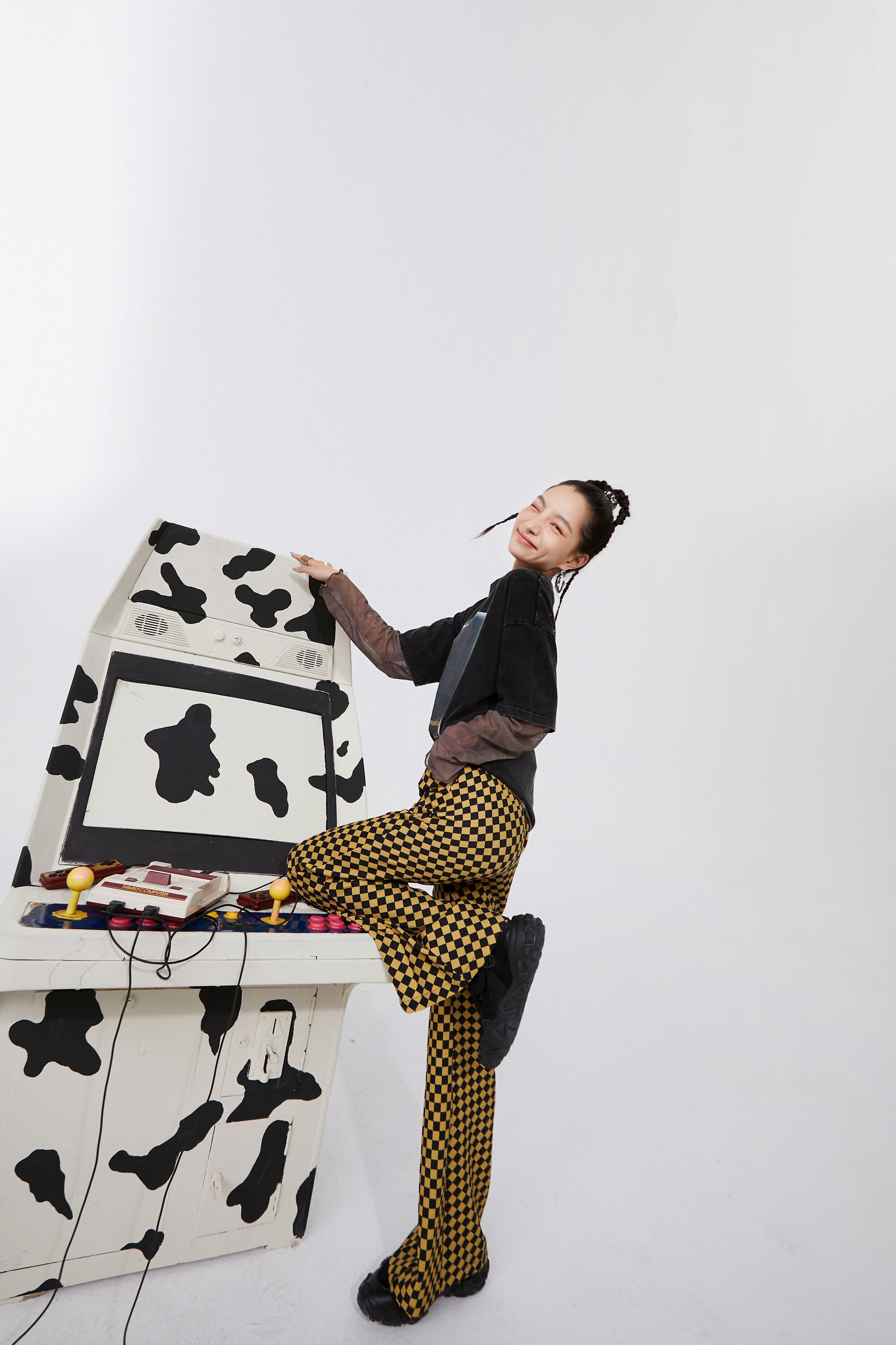 A pair of stylish yellow plaid high waist casual women flare pants, showcasing a chic design suitable for spring and autumn wear.