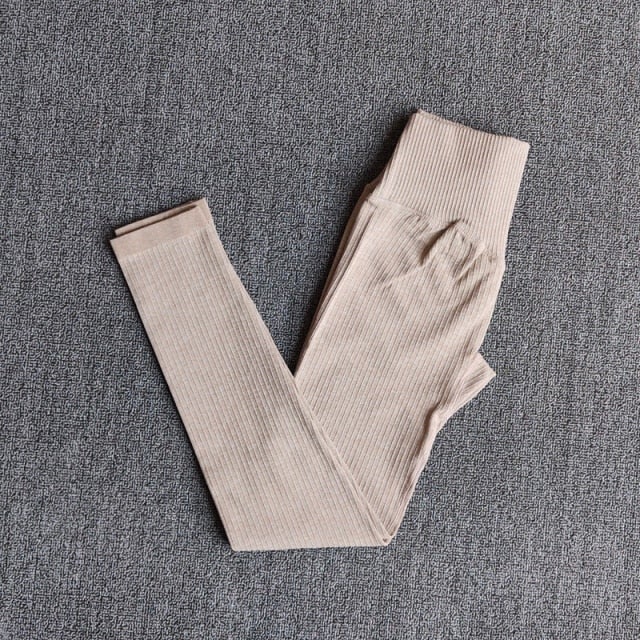 A pair of WAREBALL seamless yoga pants in various colors, showcasing the high waist design and ankle-length fit, ideal for women's activewear.