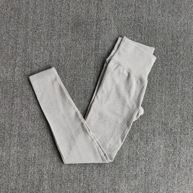 A pair of WAREBALL seamless yoga pants in various colors, showcasing the high waist design and ankle-length fit, ideal for women's activewear.