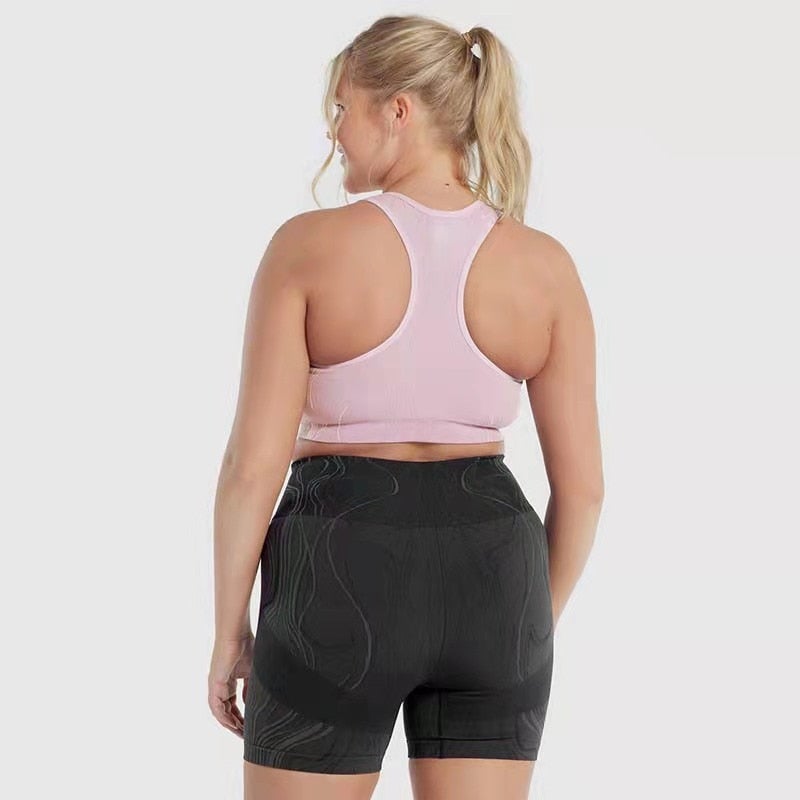 High waist push up sports shorts for women in black, pink, and blue, designed for yoga, cycling, and running.