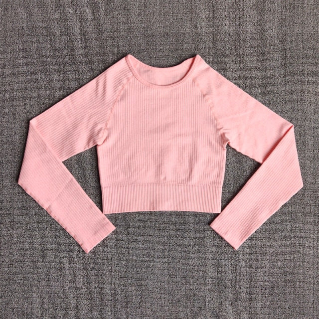 Women's seamless long sleeve yoga crop top in various colors, designed for fitness and comfort during workouts.