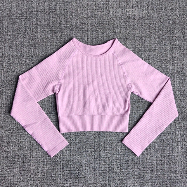Women's seamless long sleeve yoga crop top in various colors, designed for fitness and comfort during workouts.