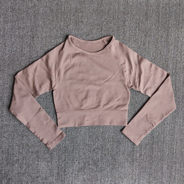 Women's seamless long sleeve yoga crop top in various colors, designed for fitness and comfort during workouts.