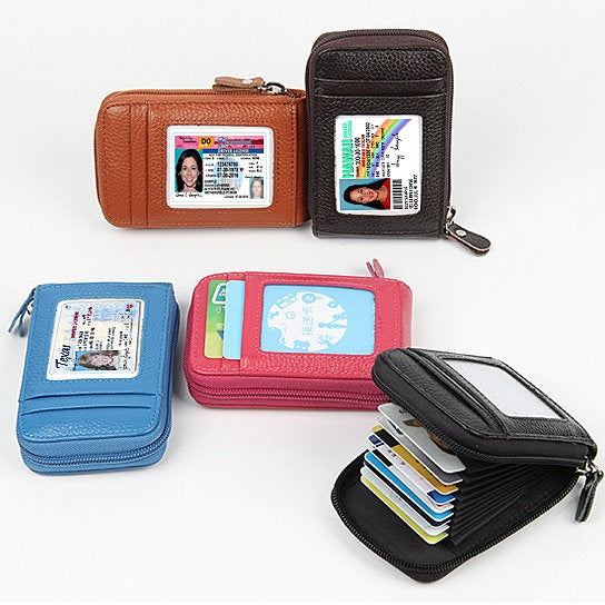 Zip Vault RFID Blocker Card Holder and Wallet in various colors, showcasing its sleek design and transparent ID window.
