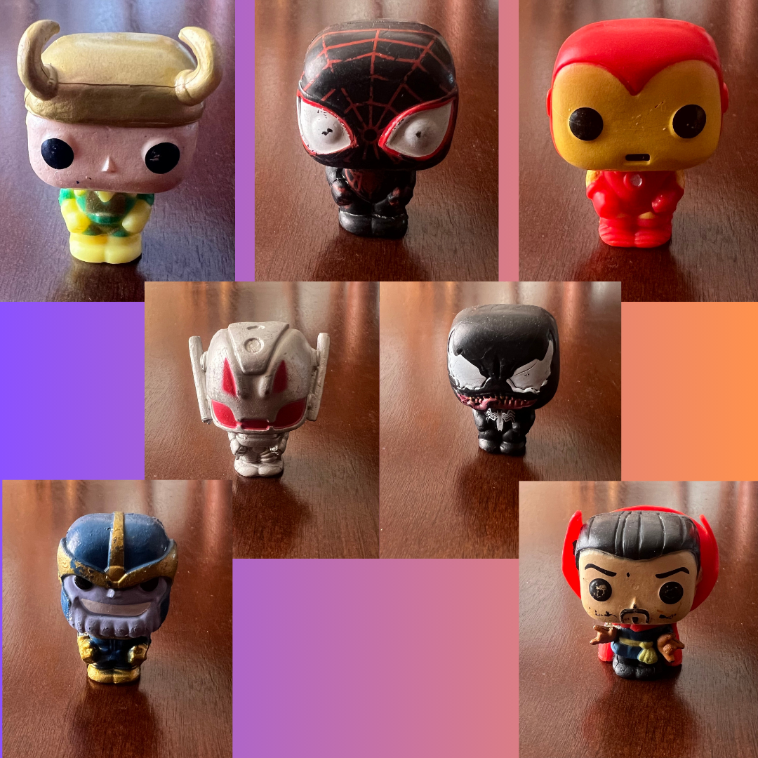 A colorful set of 7 superhero action figures including Ironman, Spiderman, and Venom, perfect for kids' play and cake decoration.