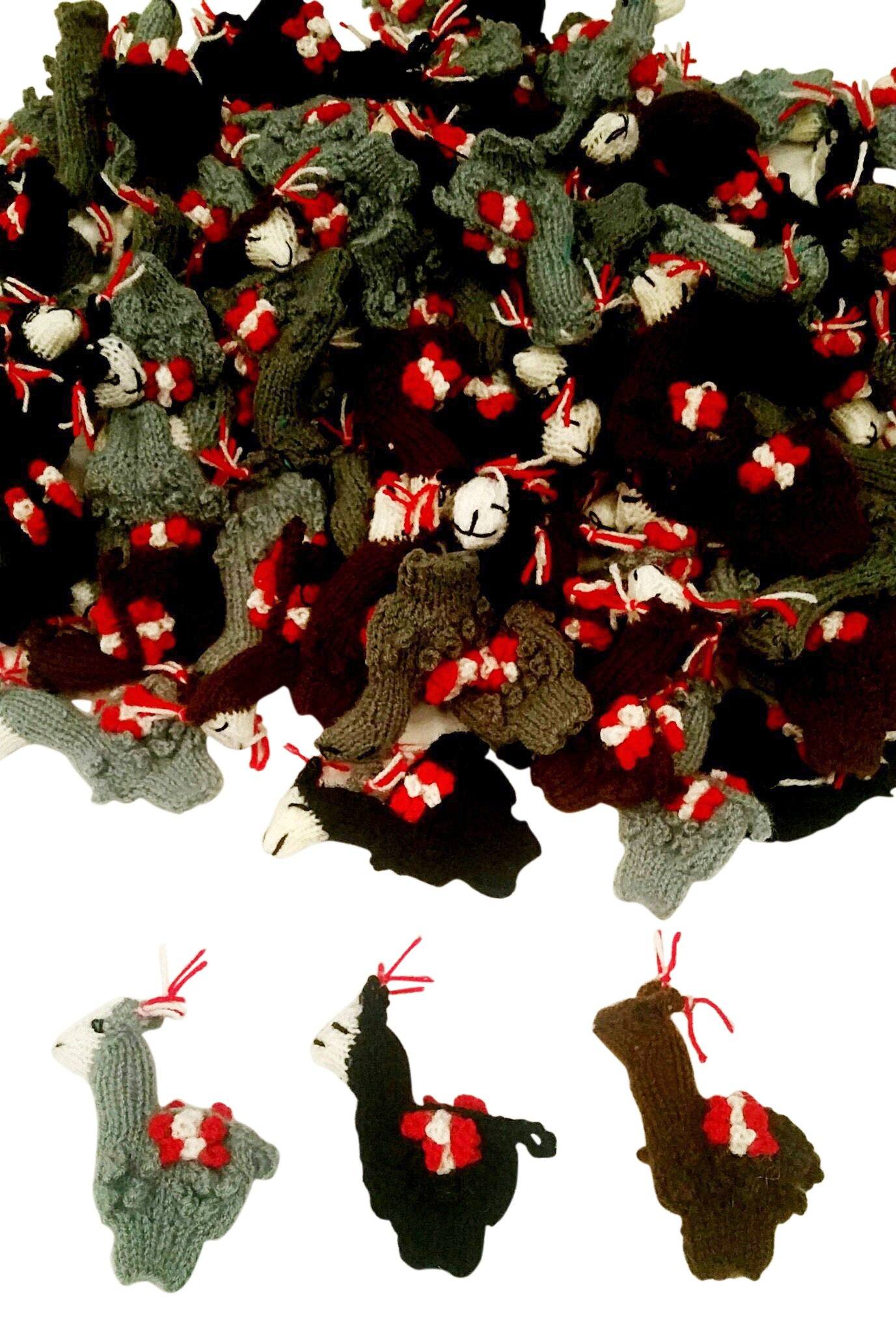 A colorful assortment of handmade alpaca finger puppets, featuring various colors and designs, perfect for children's play and gifts.