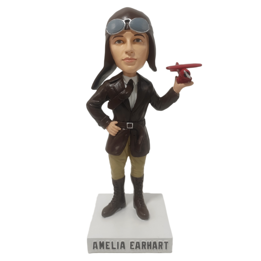 Limited edition Amelia Earhart bobblehead featuring her with a red Lockheed Vega 5b, symbolizing aviation history.