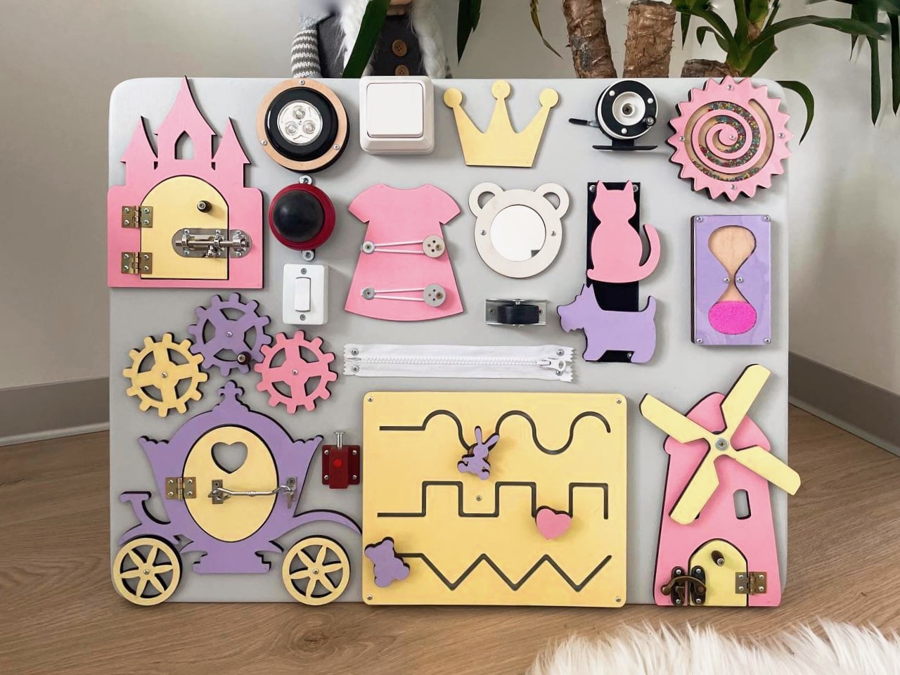 Purple Busy Board MAXI featuring various engaging activities for toddlers, designed to enhance motor skills and sensory development.