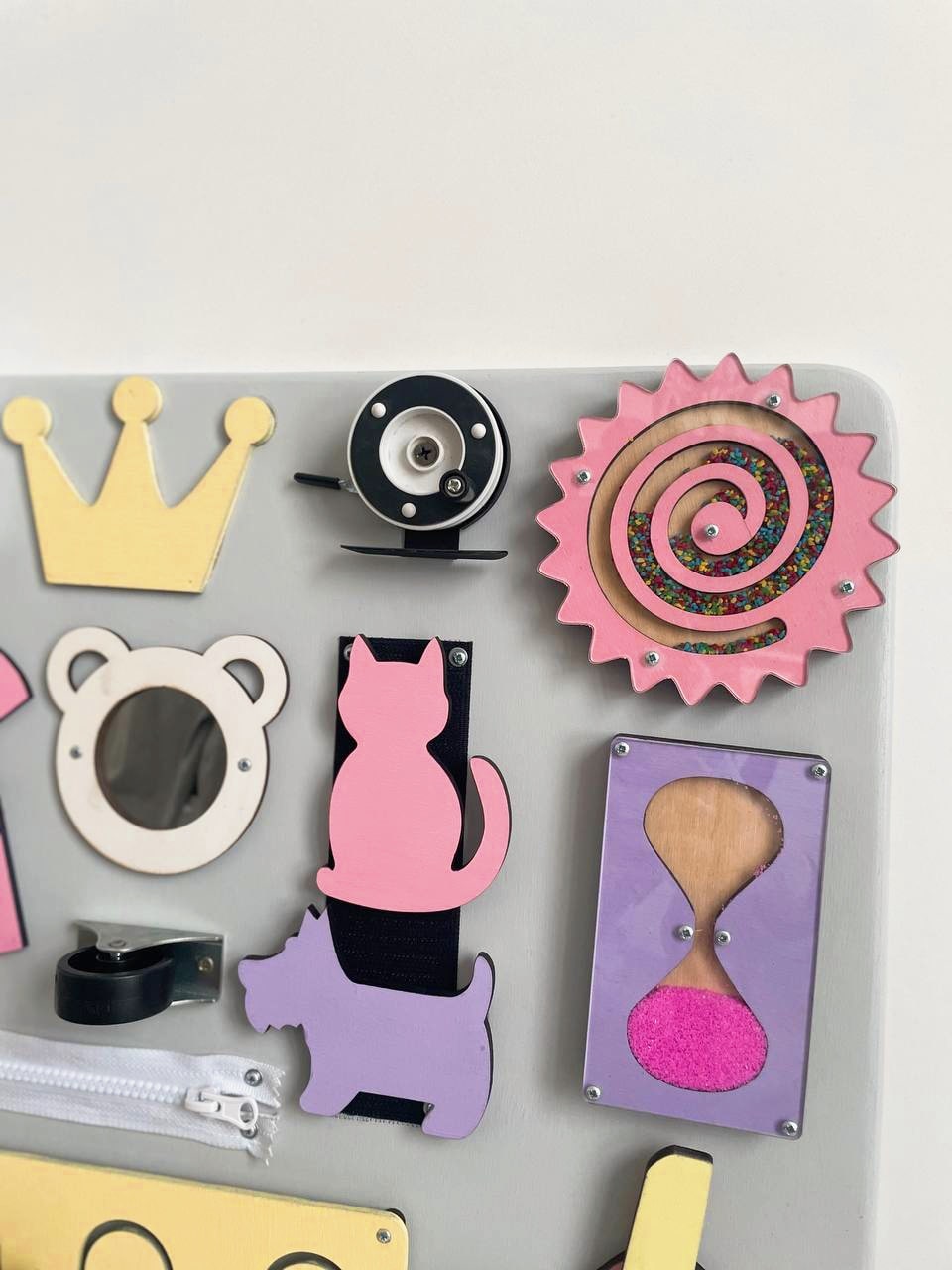 Purple Busy Board MAXI featuring various engaging activities for toddlers, designed to enhance motor skills and sensory development.