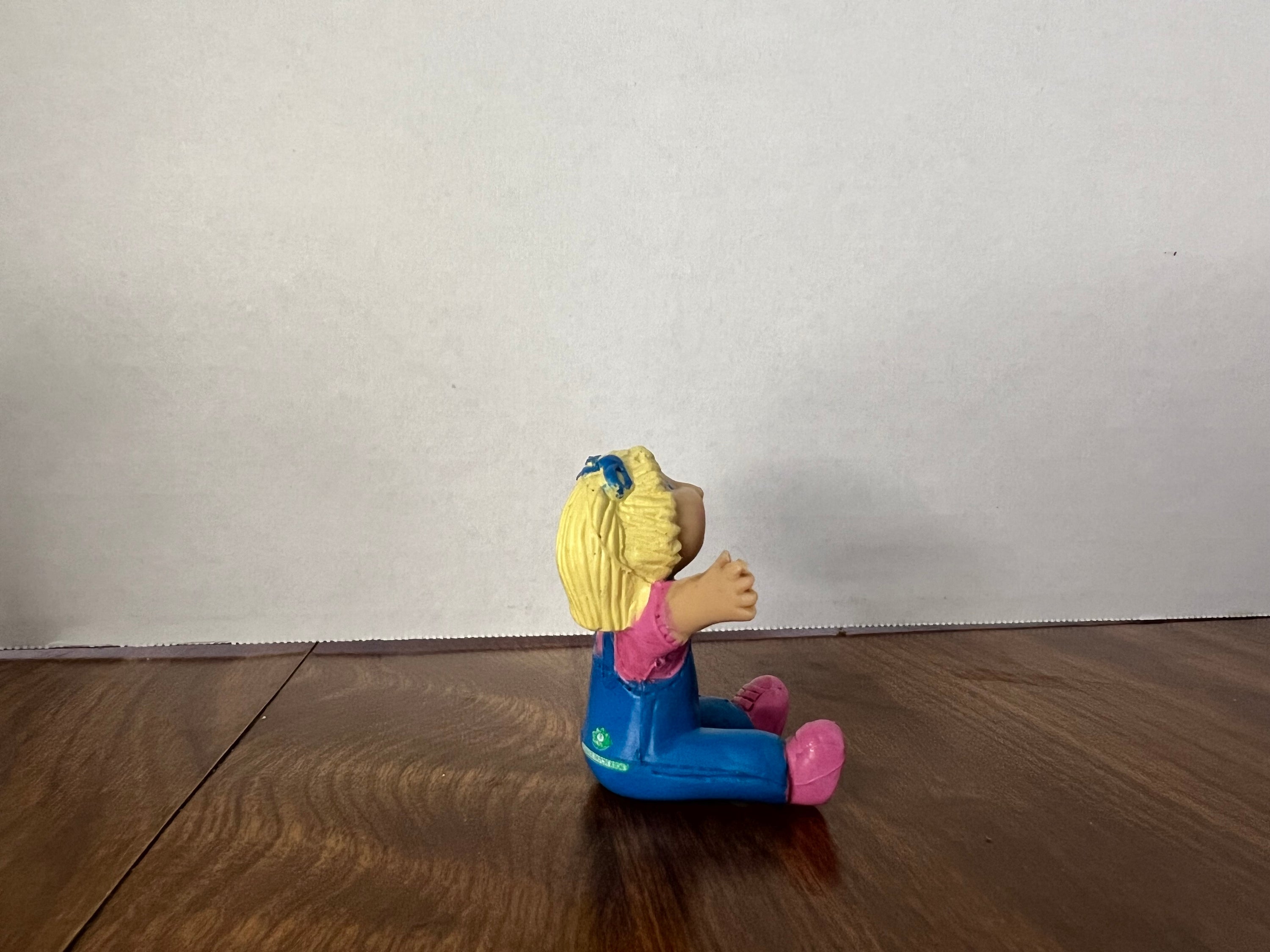 Cabbage Patch Kids Deluxe Miniatures figure with blonde hair and blue eyes, missing swing and left pinky, ideal for collectors.