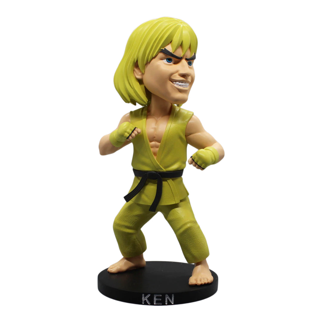Capcom Street Fighter Ken Masters bobblehead in white gi, standing 8 inches tall on a colorful base, hand-painted and made of polystone.