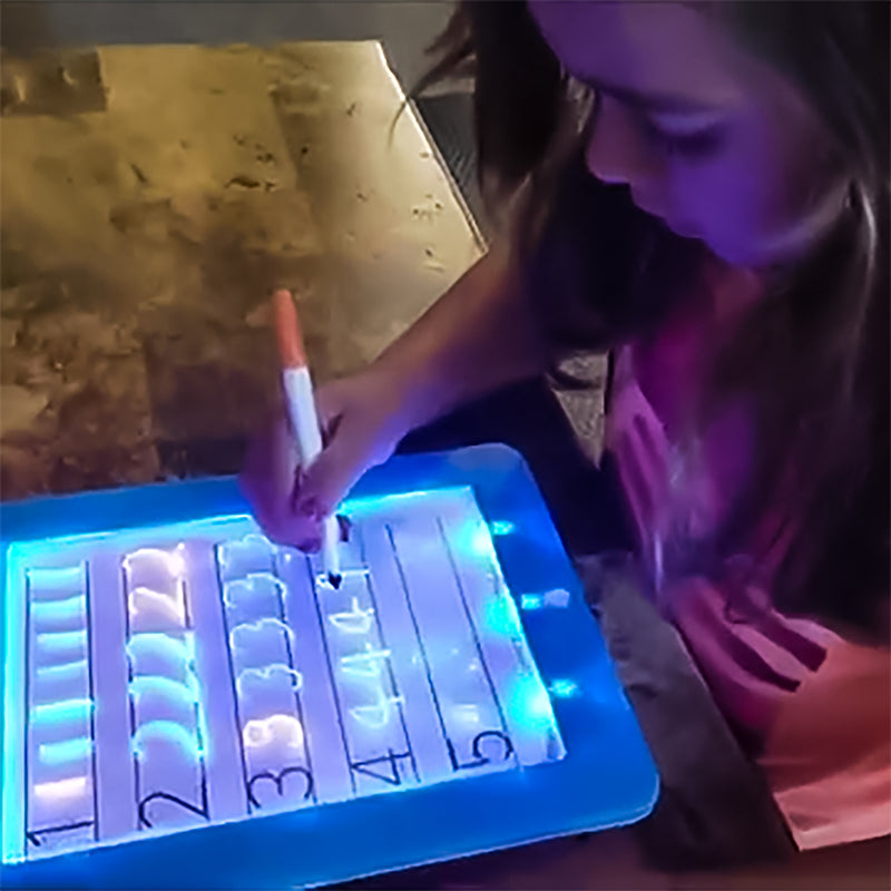 Disco Scribble Light-up Sound Activated Drawing Board with colorful LED lights and drawing accessories.