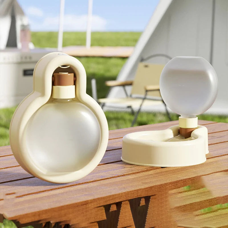 Lightweight portable dog water bottle in green, designed for outdoor travel with a wide drinking tank and stable base.