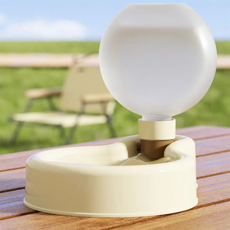 Lightweight portable dog water bottle in green, designed for outdoor travel with a wide drinking tank and stable base.