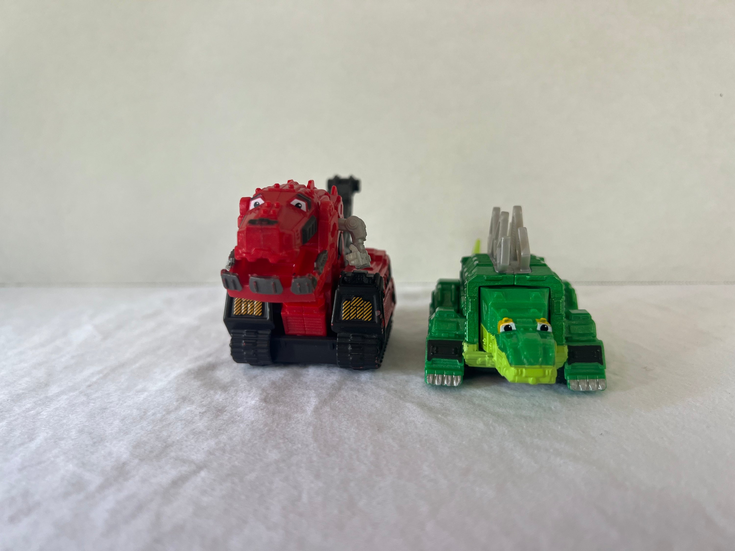 DreamWorks Dinotrux Diecast Vehicle set featuring Garby and Ty Rux action figures in vibrant colors.