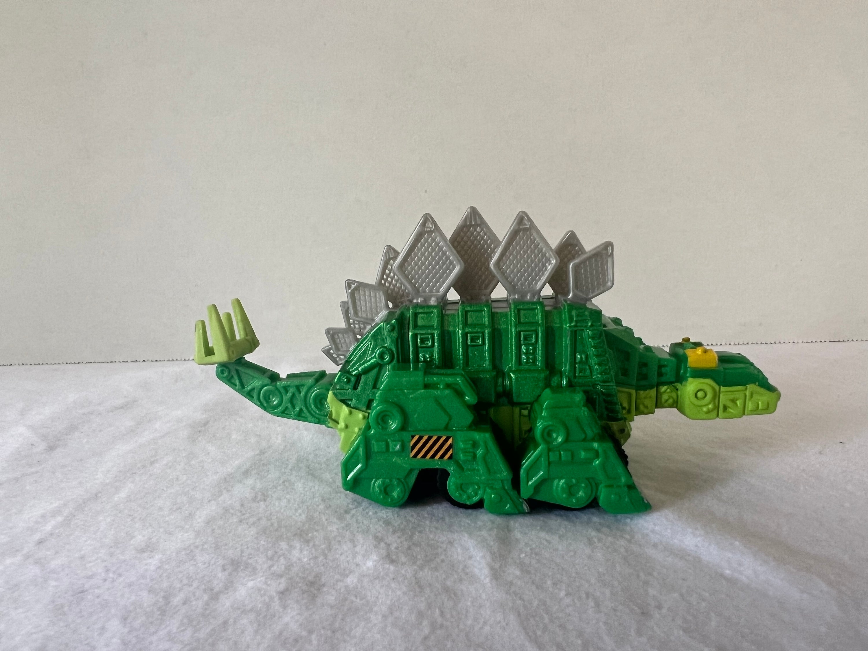 DreamWorks Dinotrux Diecast Vehicle set featuring Garby and Ty Rux action figures in vibrant colors.