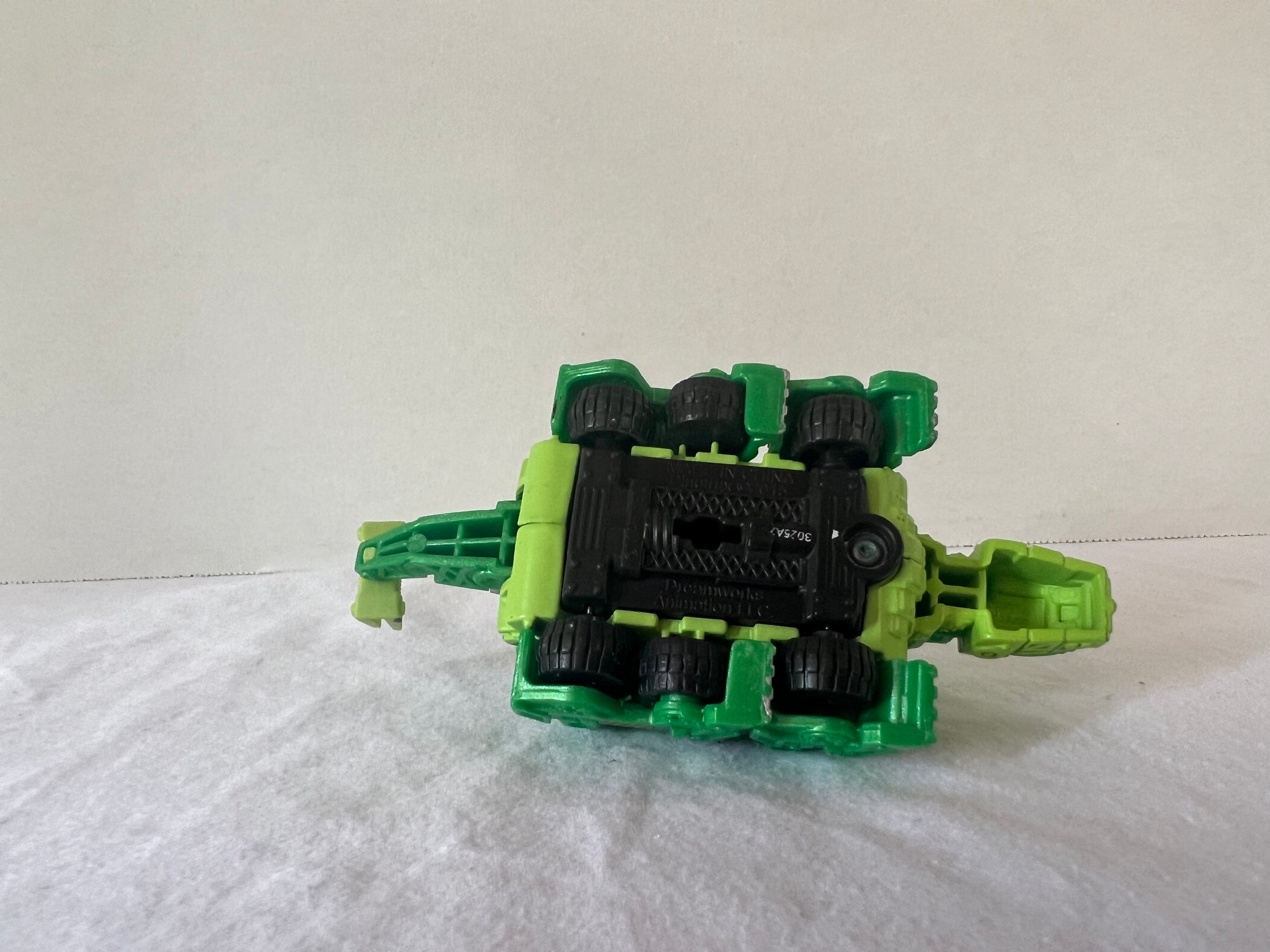 DreamWorks Dinotrux Diecast Vehicle set featuring Garby and Ty Rux action figures in vibrant colors.