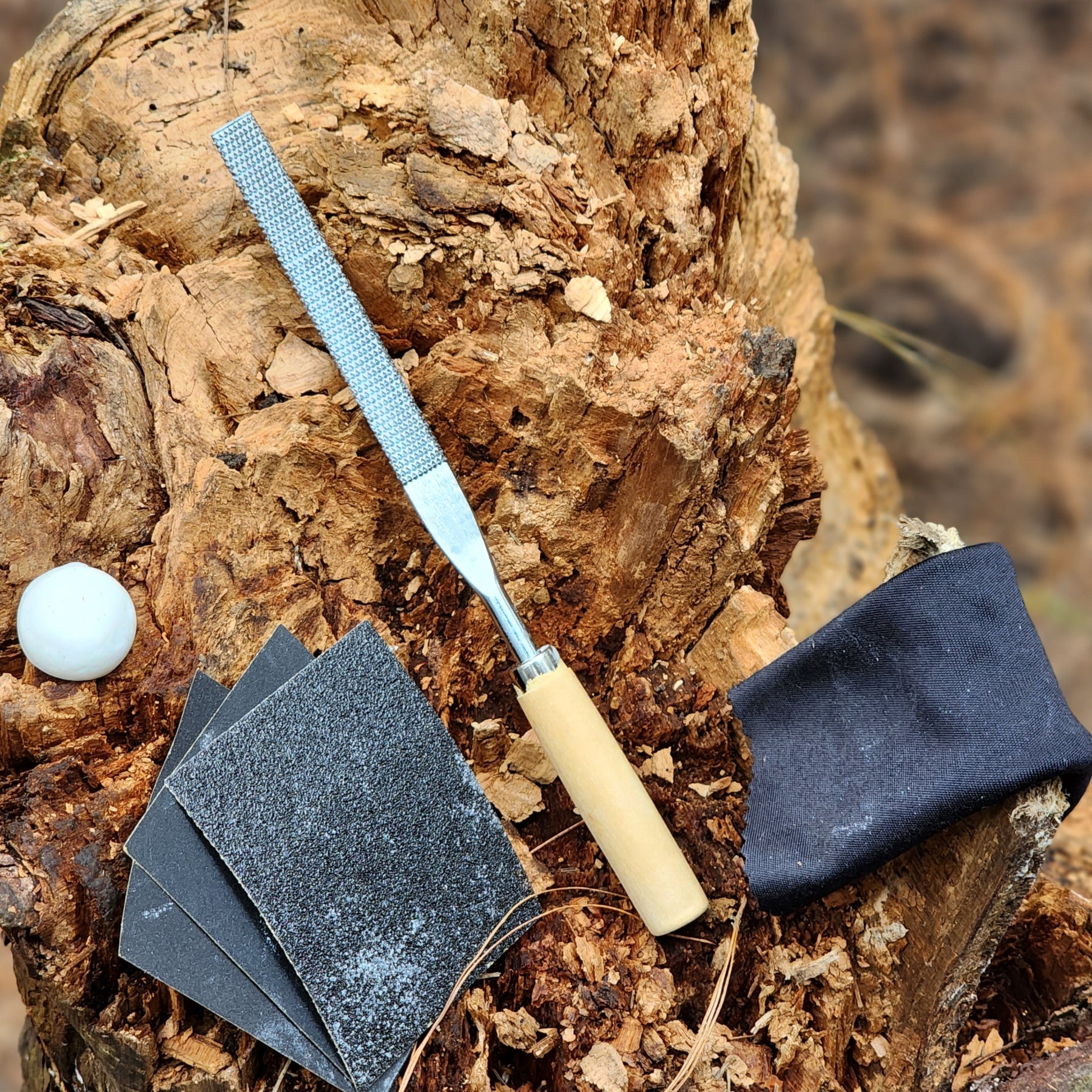 A complete Elephant Soapstone Carving Kit featuring precut soapstone, carving tools, sandpaper, wax, and a manual, ideal for kids and adults.