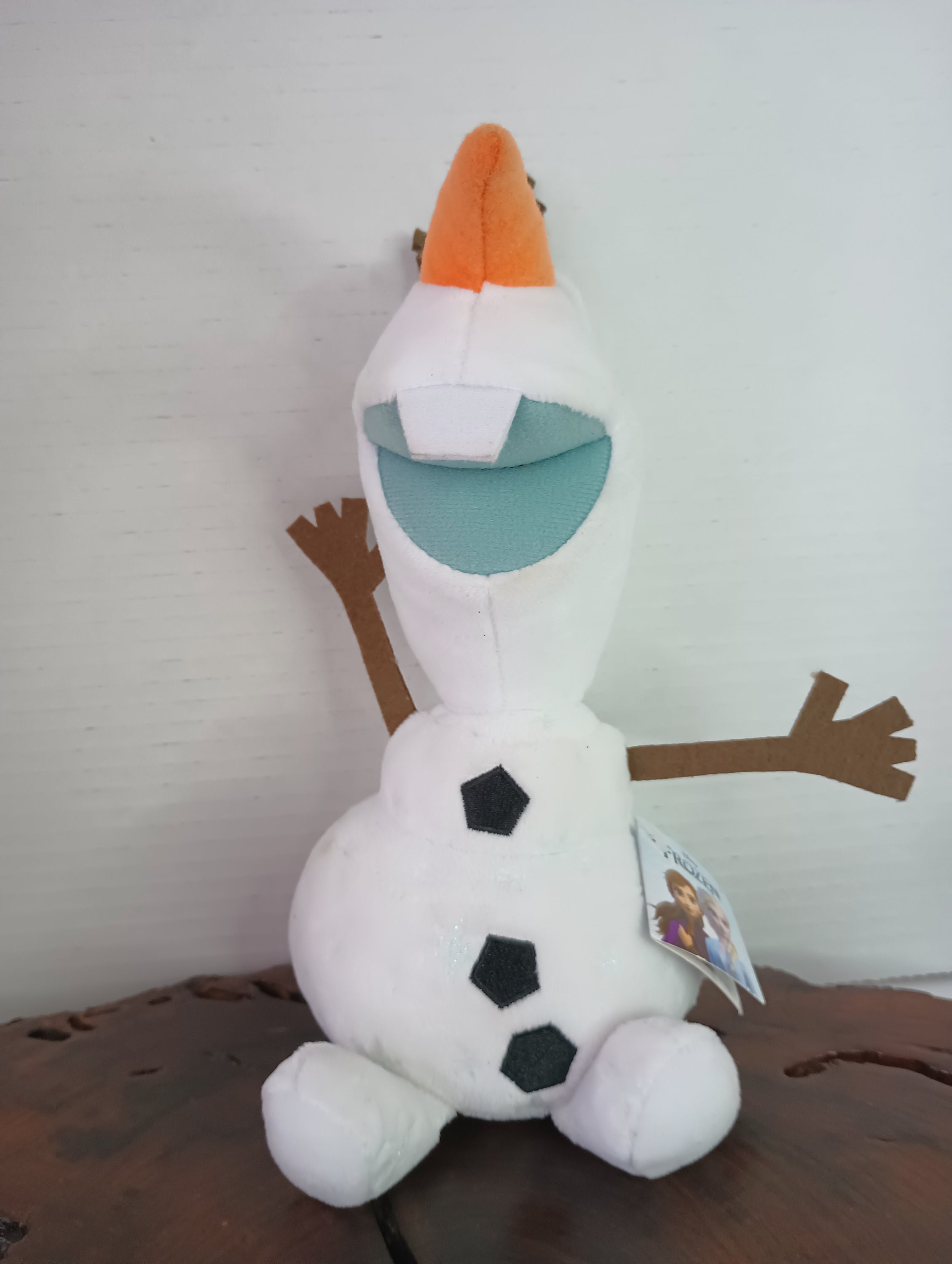Frozen 9-inch Olaf stuffed animal from Disney, featuring a soft white design, perfect for children aged 3 and above.