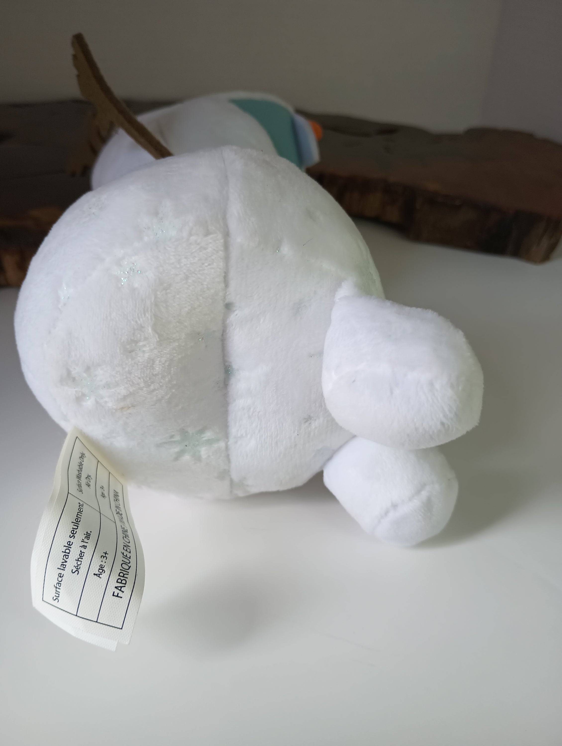 Frozen 9-inch Olaf stuffed animal from Disney, featuring a soft white design, perfect for children aged 3 and above.