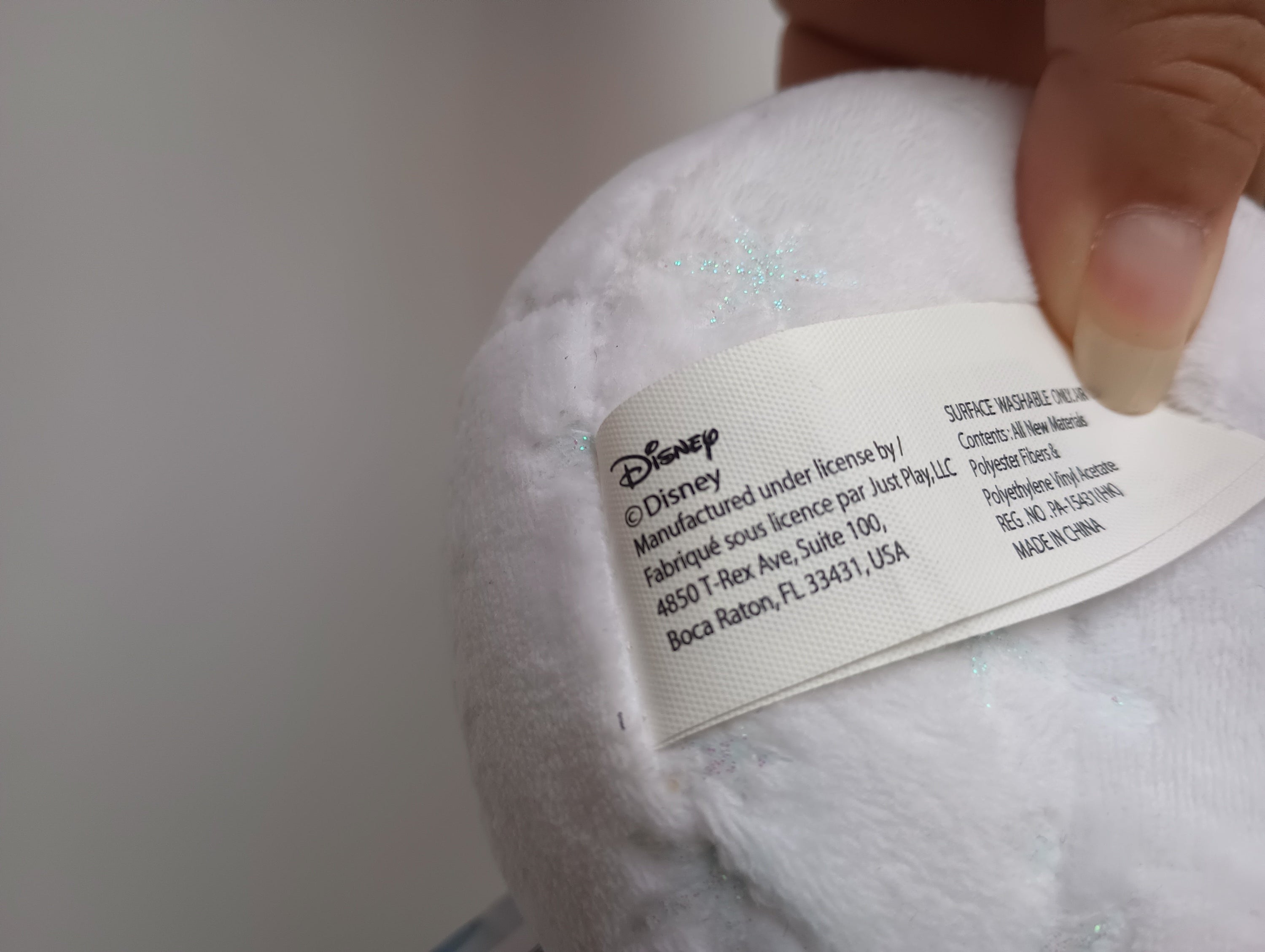 Frozen 9-inch Olaf stuffed animal from Disney, featuring a soft white design, perfect for children aged 3 and above.