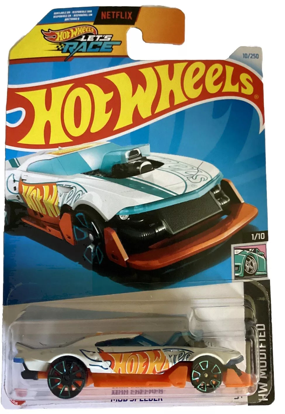 Hot Wheels HW Modified (2024) die-cast model in white and orange, showcasing intricate details and vibrant colors.