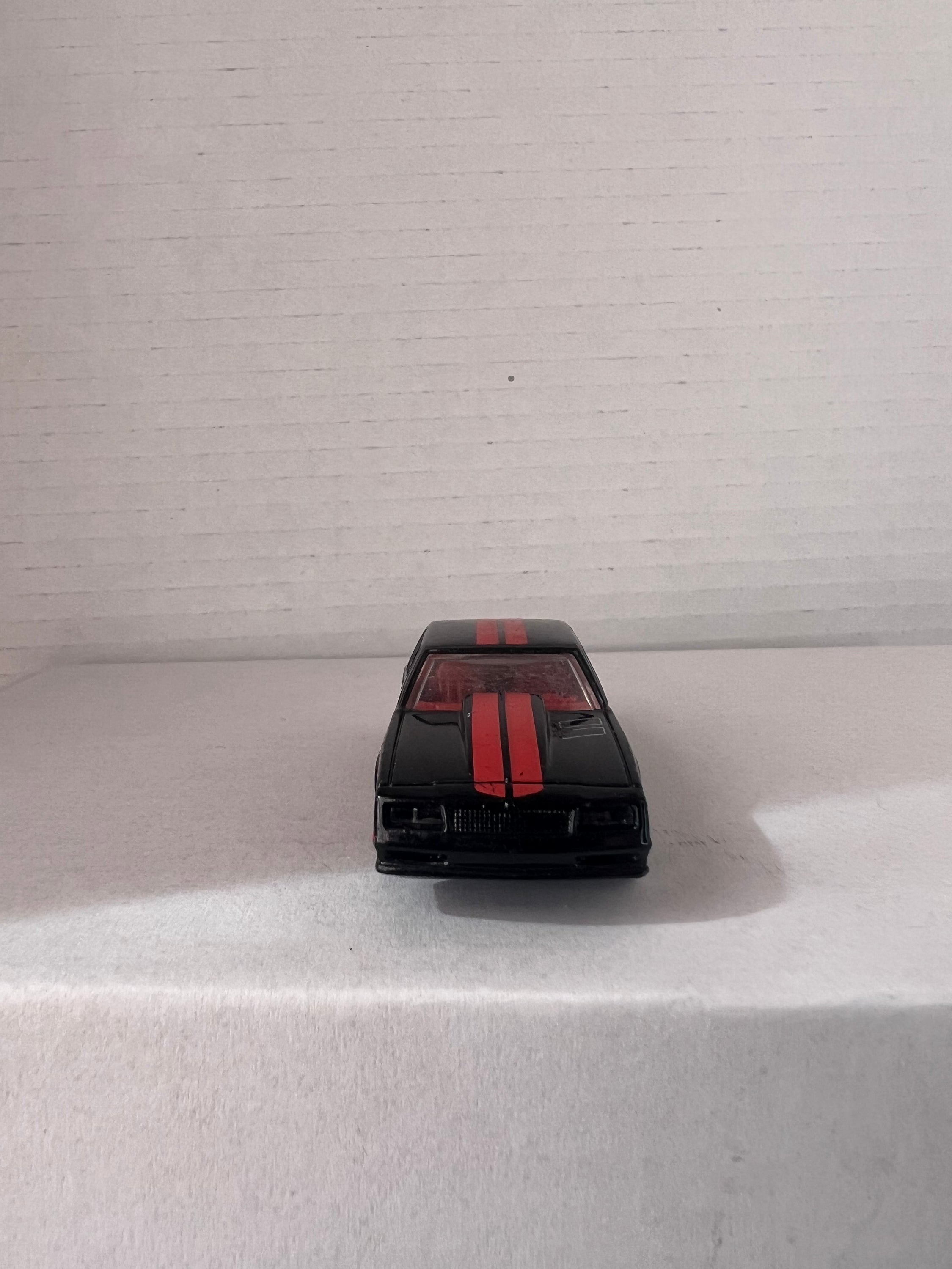 Hot Wheels HW Workshop (2015) set featuring '67 Pontiac GTO and '86 Monte Carlo SS die-cast cars in vibrant colors.