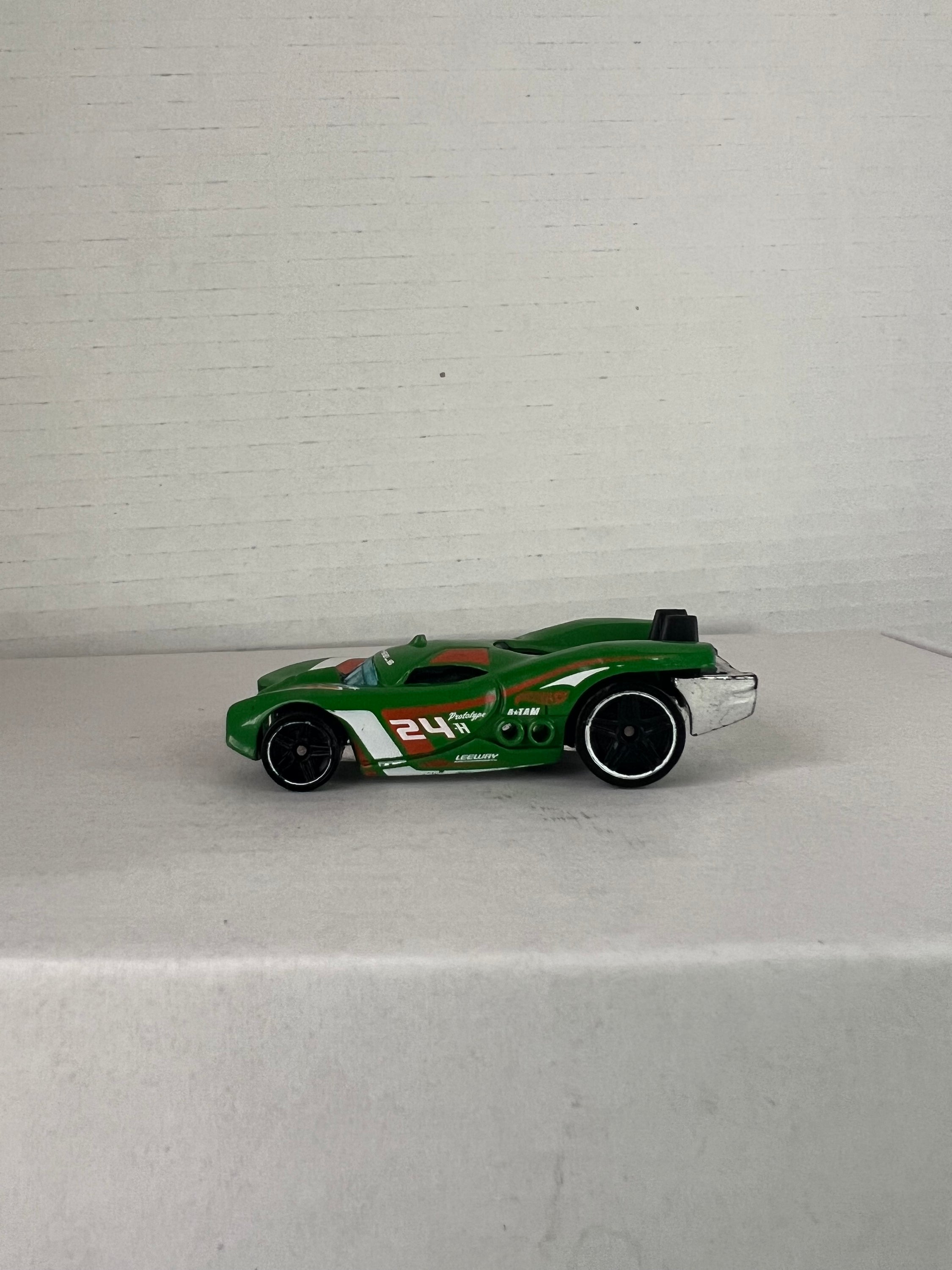 Hot Wheels Prototype H-24 Advent Calendar 2016 in green, showcasing die-cast metal design and intricate details.