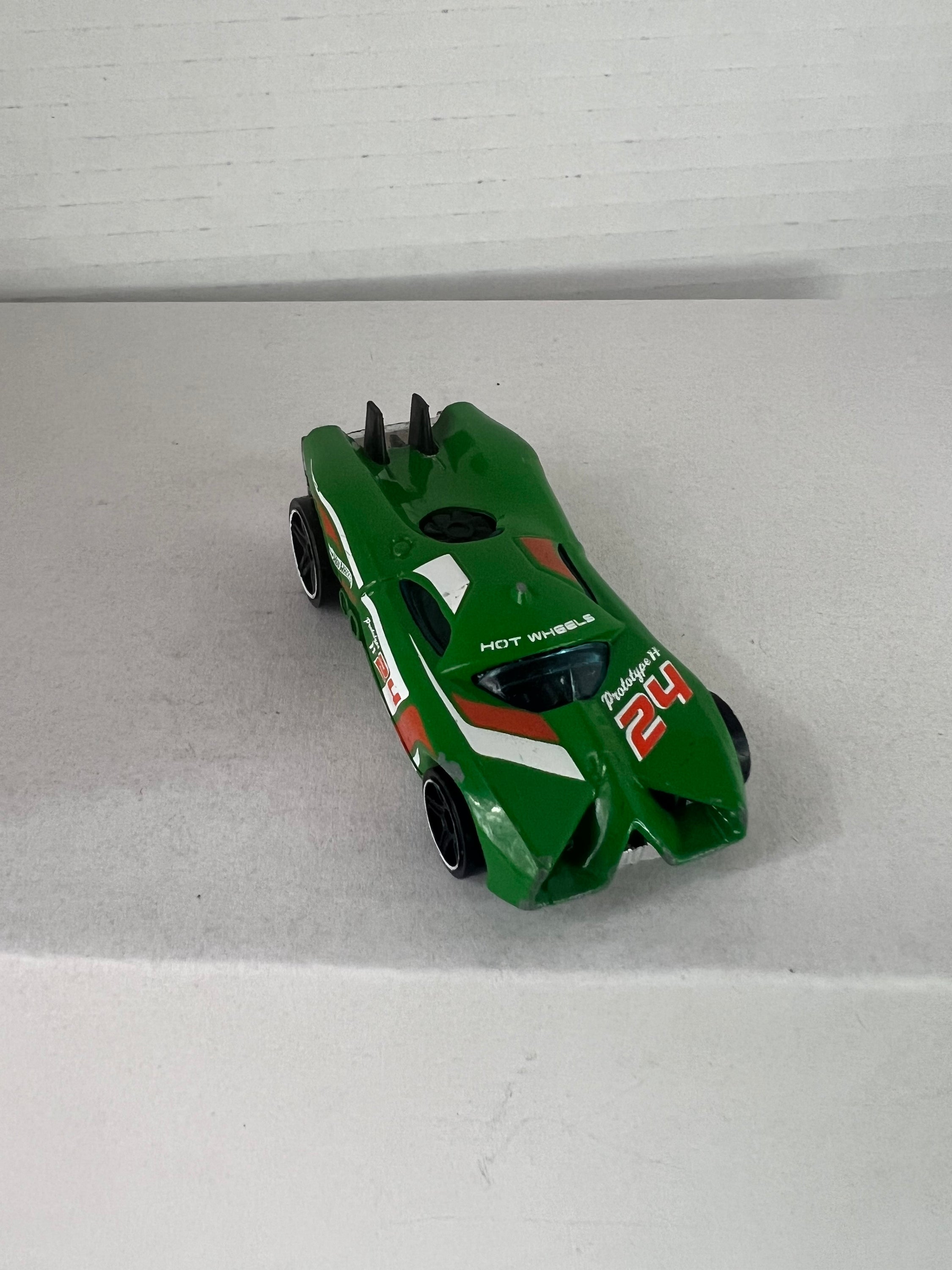 Hot Wheels Prototype H-24 Advent Calendar 2016 in green, showcasing die-cast metal design and intricate details.