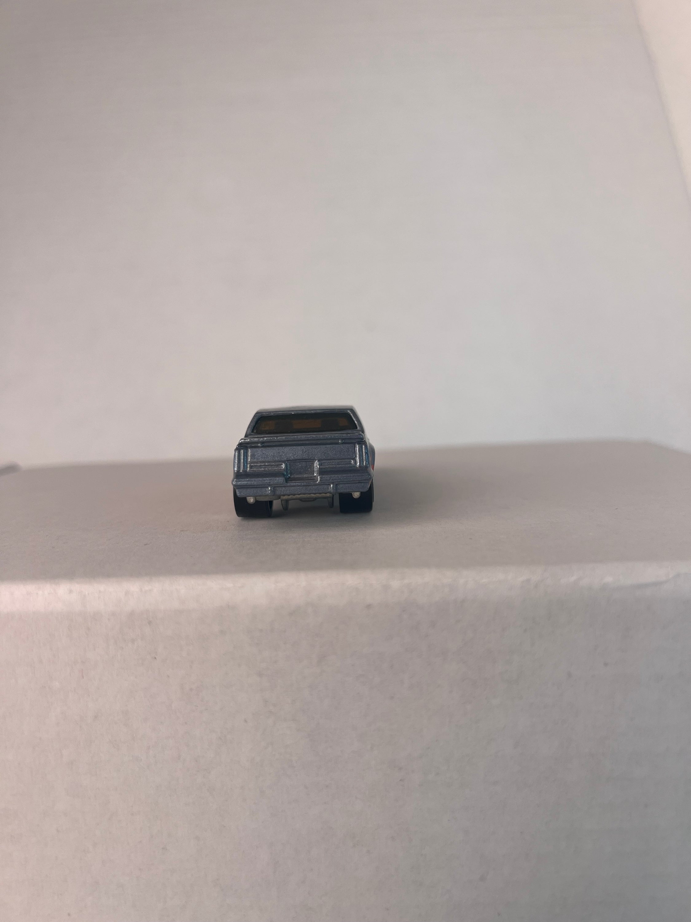 Hot Wheels Retro Series (2016) Target Exclusive featuring '87 Toyota Pickup and '84 Hurst Olds die-cast models in vibrant colors.