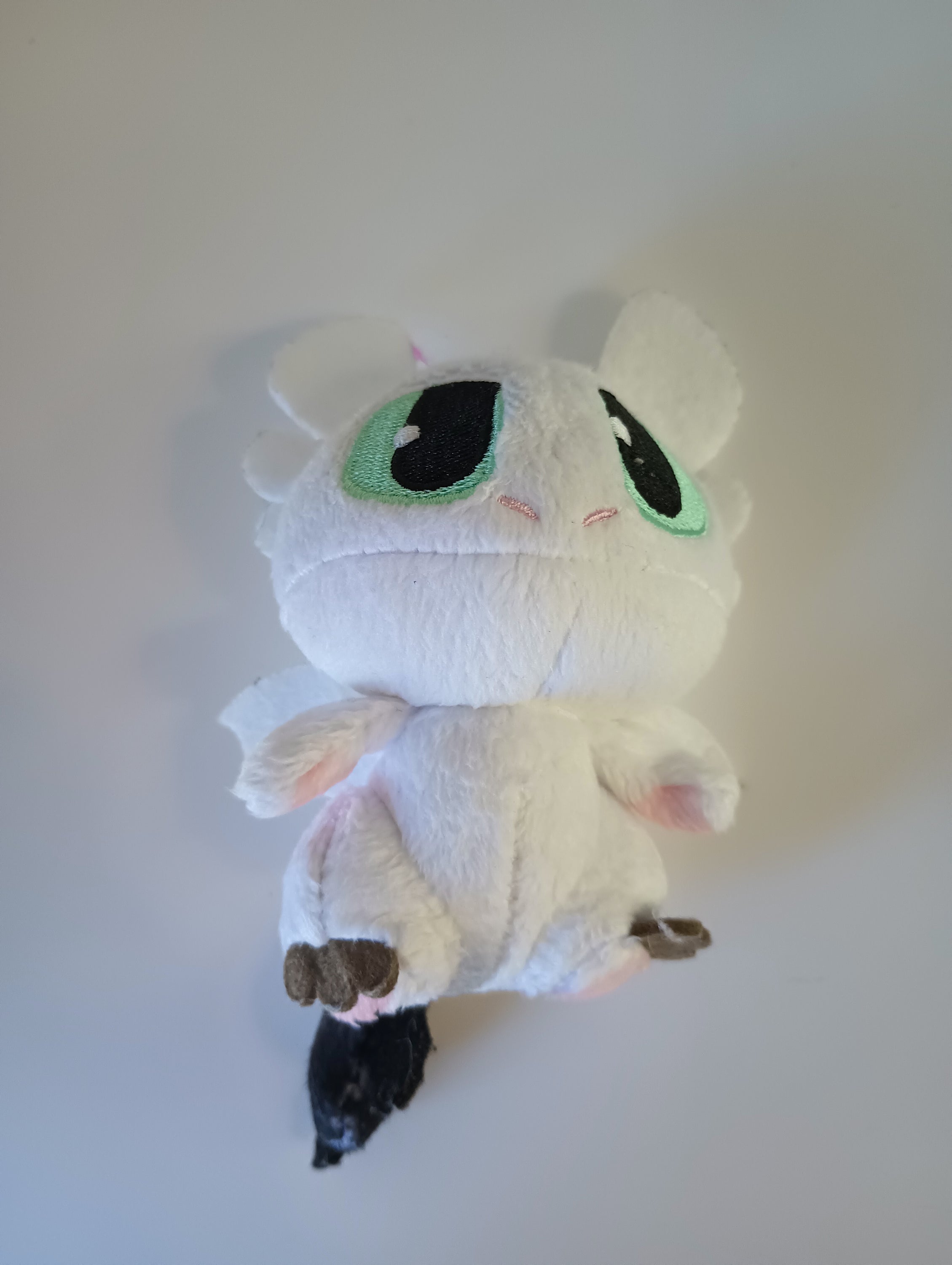 3-inch Light Fury plush toy from How to Train Your Dragon, featuring soft white fur and intricate details, perfect for fans and collectors.
