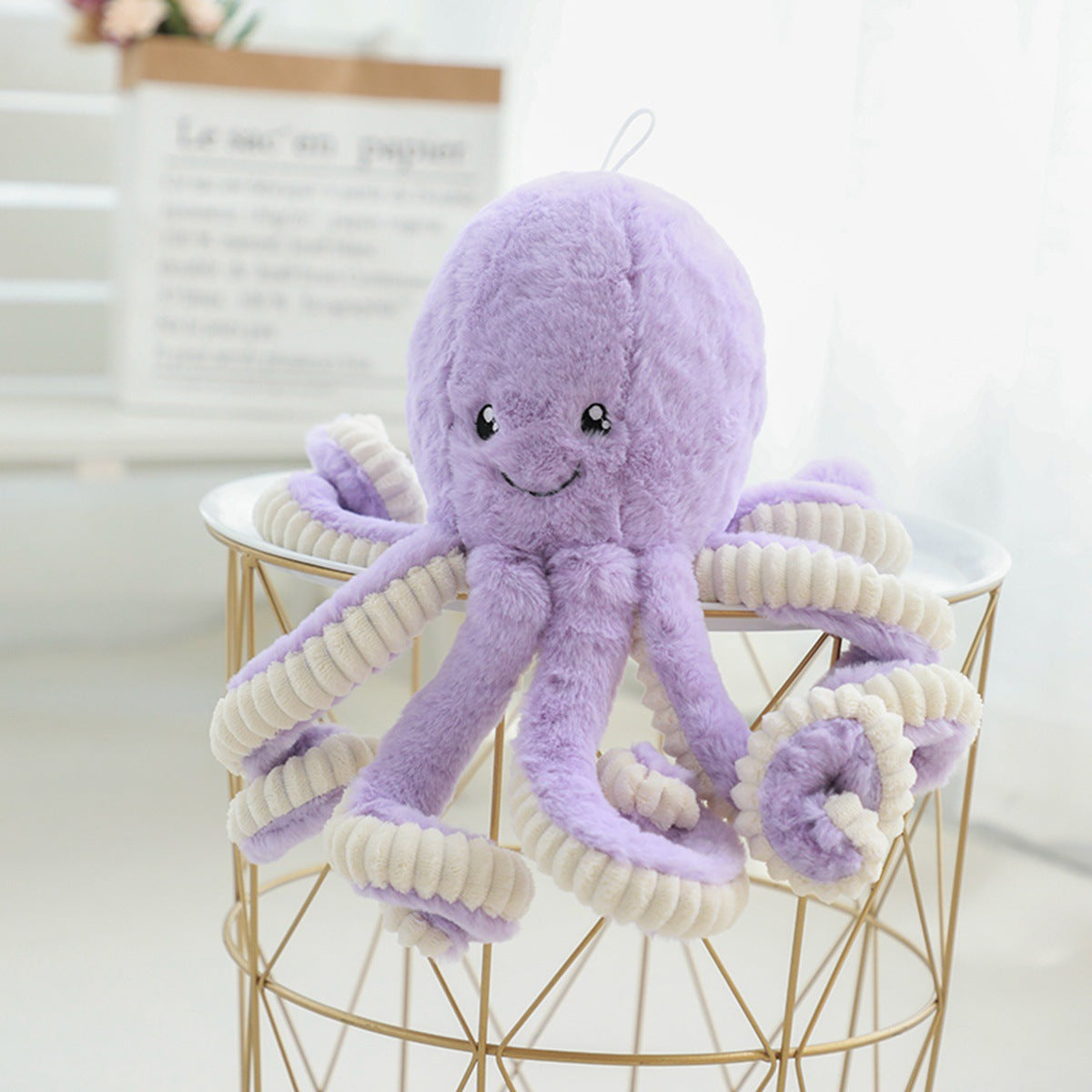 Lovely simulation octopus pendant plush stuffed toy with bright eyes and elastic legs, available in multiple colors.