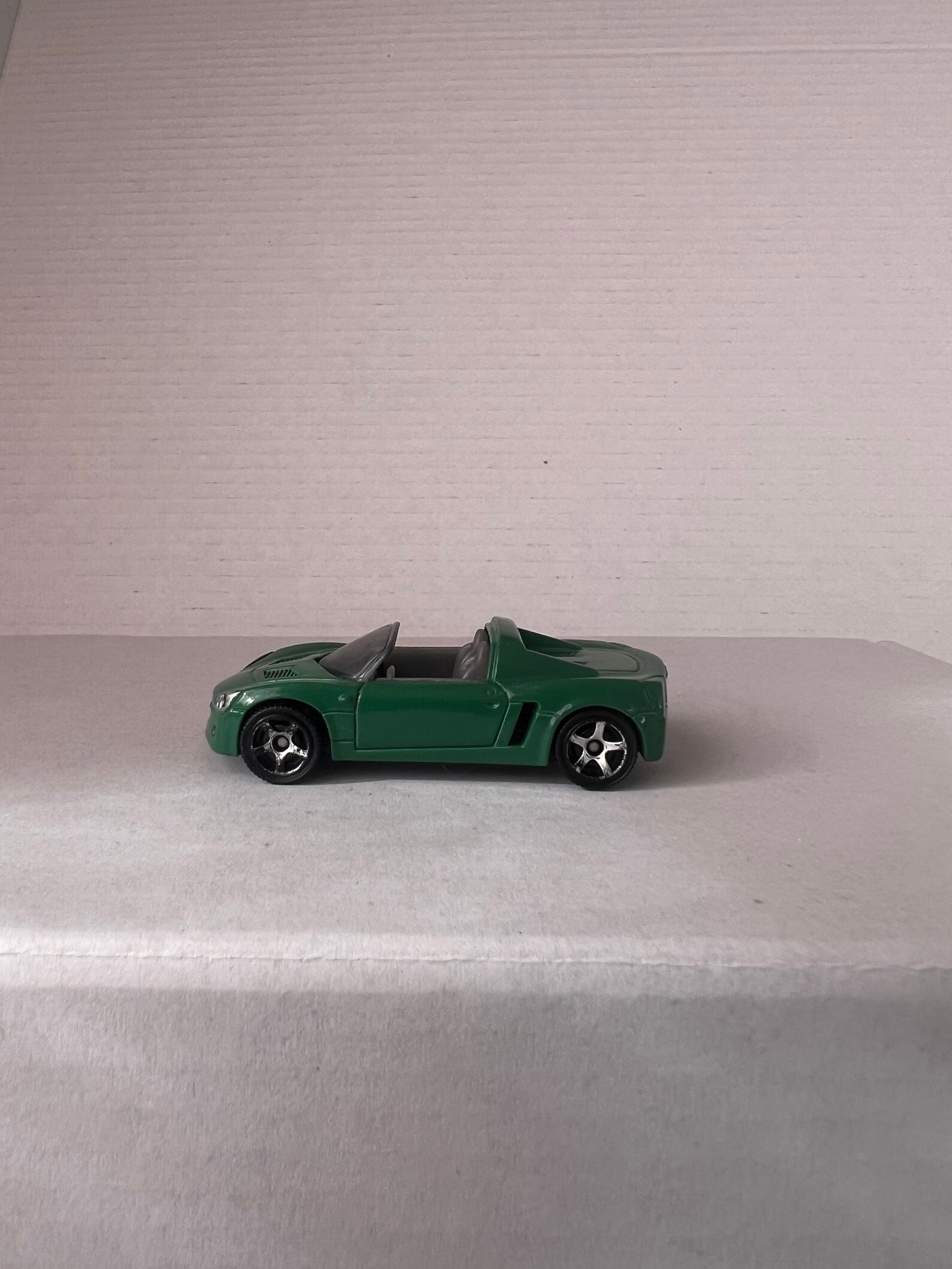 Matchbox Open Road-Sters 2017 set featuring four die-cast cars: Opel Speedster, Porsche 911 Turbo, 1971 Chevy Chevelle, and 1957 Ford Thunderbird.