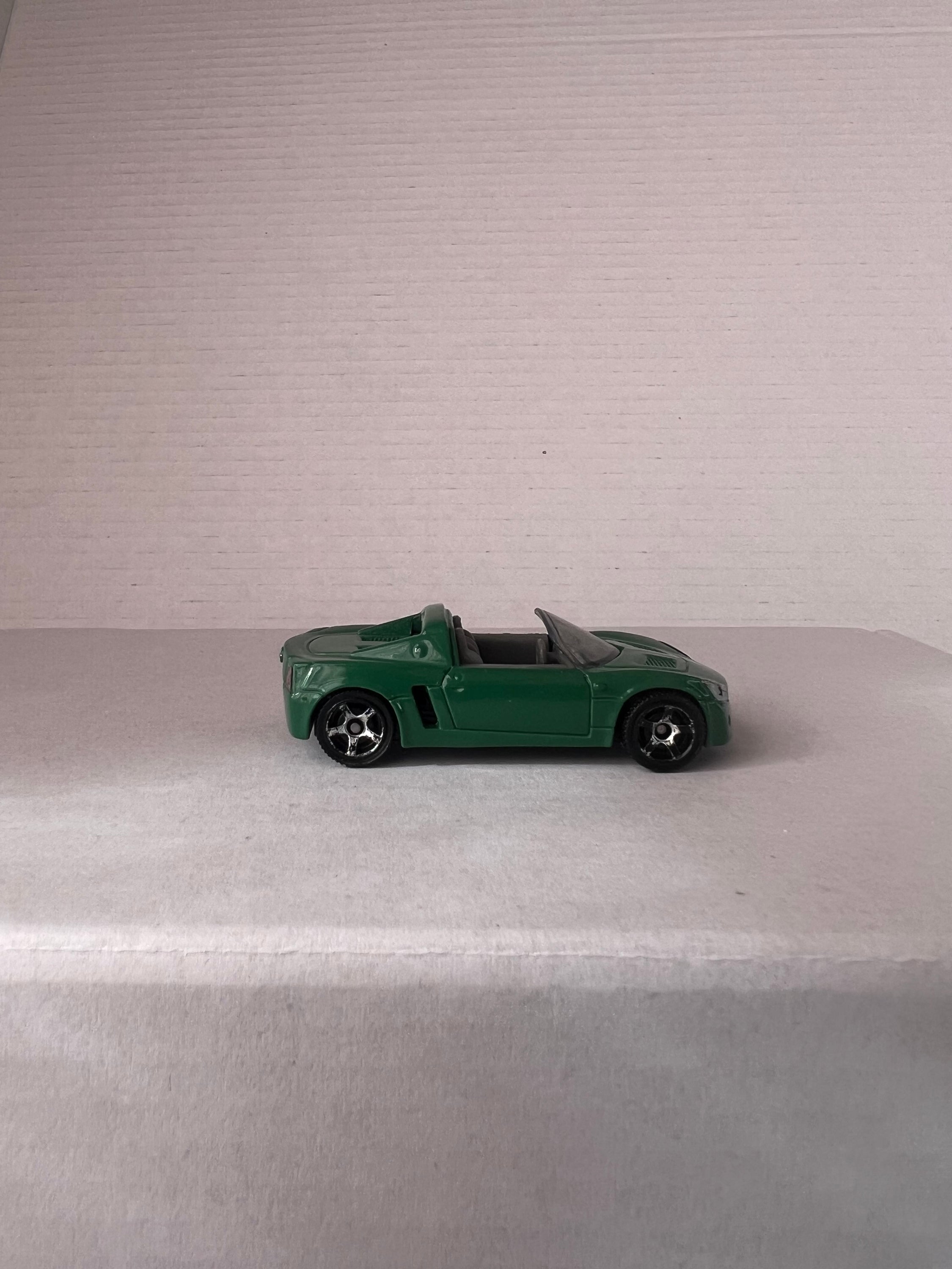 Matchbox Open Road-Sters 2017 set featuring four die-cast cars: Opel Speedster, Porsche 911 Turbo, 1971 Chevy Chevelle, and 1957 Ford Thunderbird.