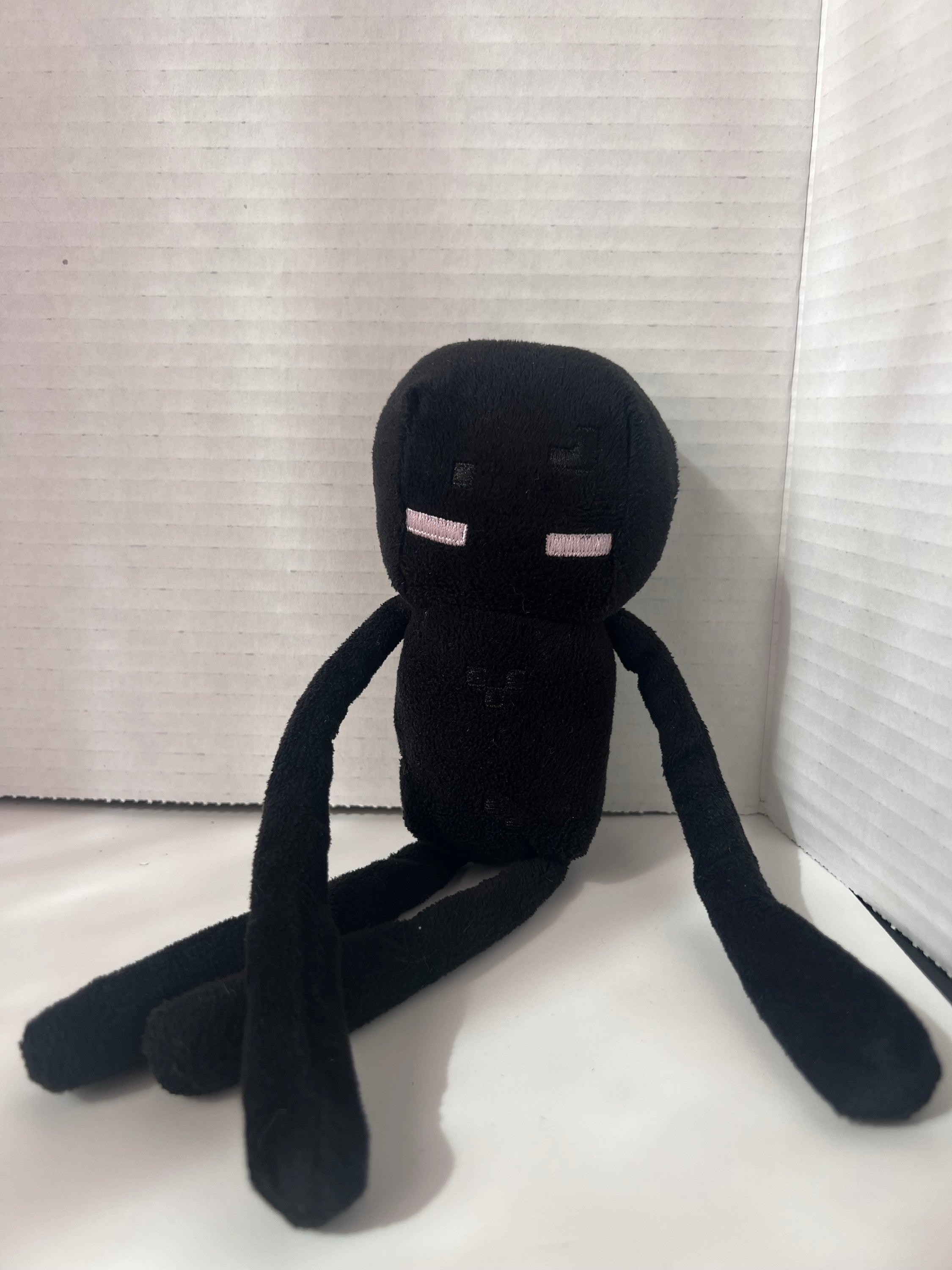 10-inch Minecraft Enderman action figure by Mojang, featuring intricate details and a black polyester finish.