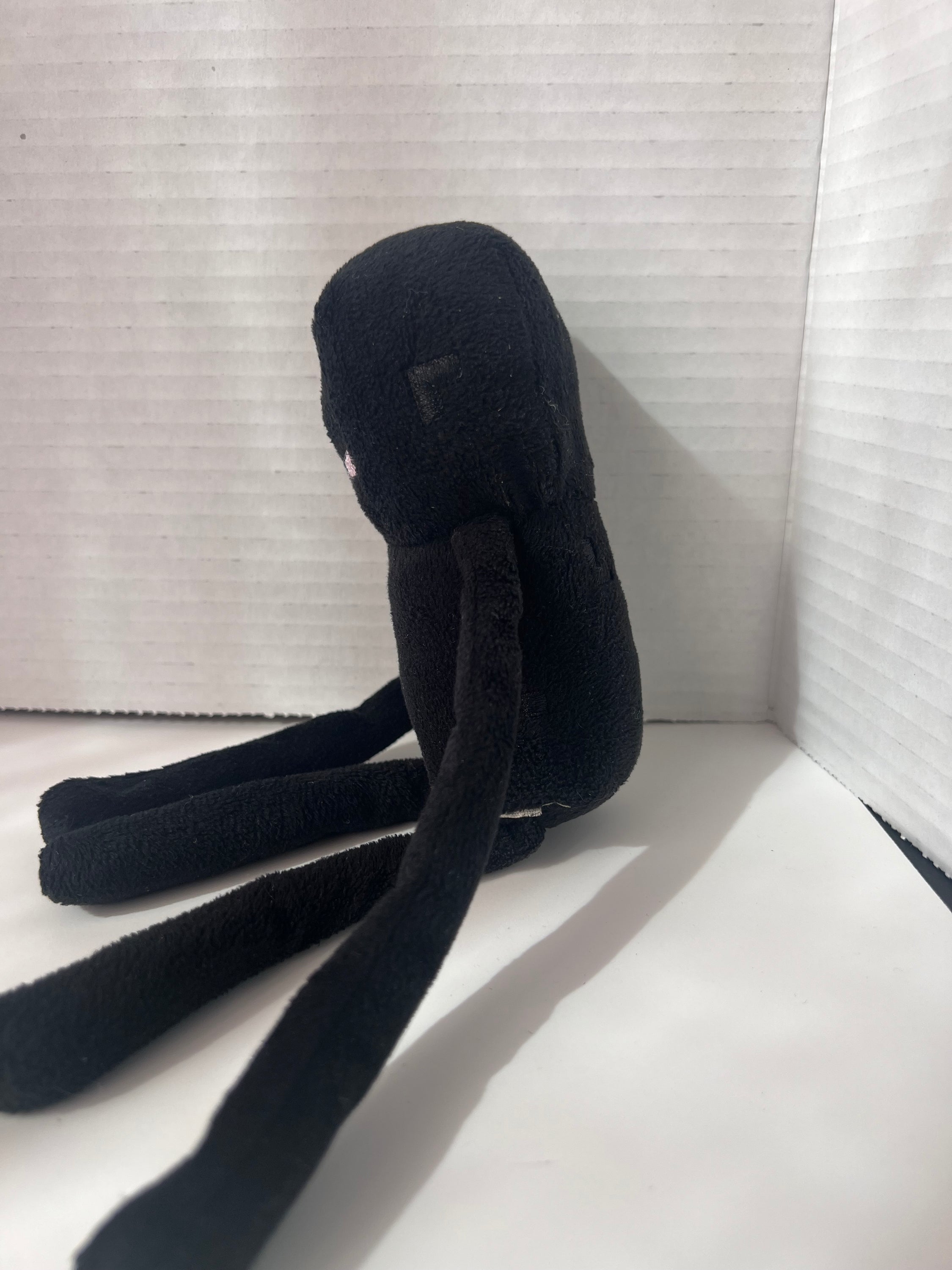 10-inch Minecraft Enderman action figure by Mojang, featuring intricate details and a black polyester finish.