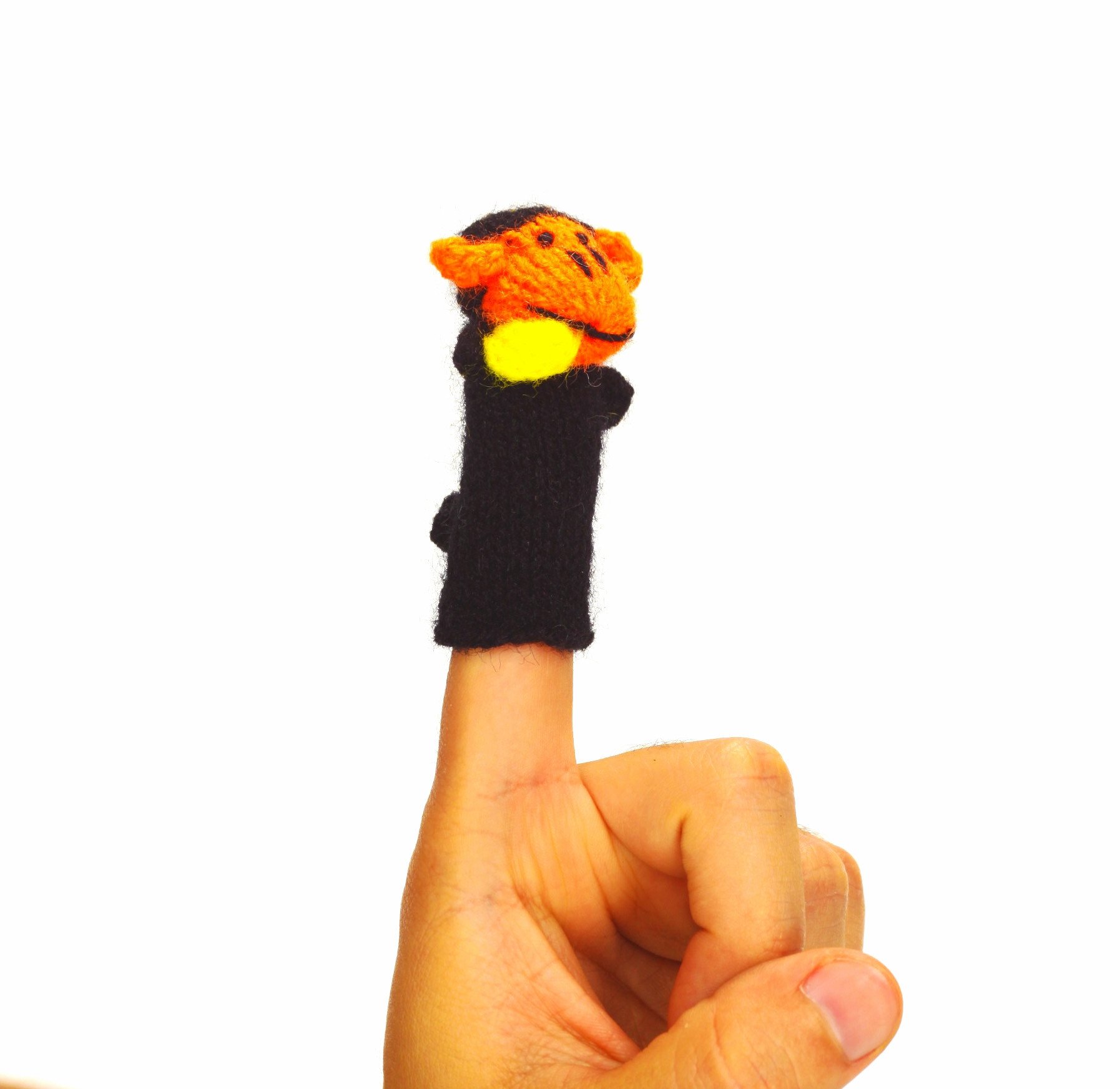 Handcrafted black and orange monkey finger puppet made from eco-friendly materials, showcasing unique artisan craftsmanship.