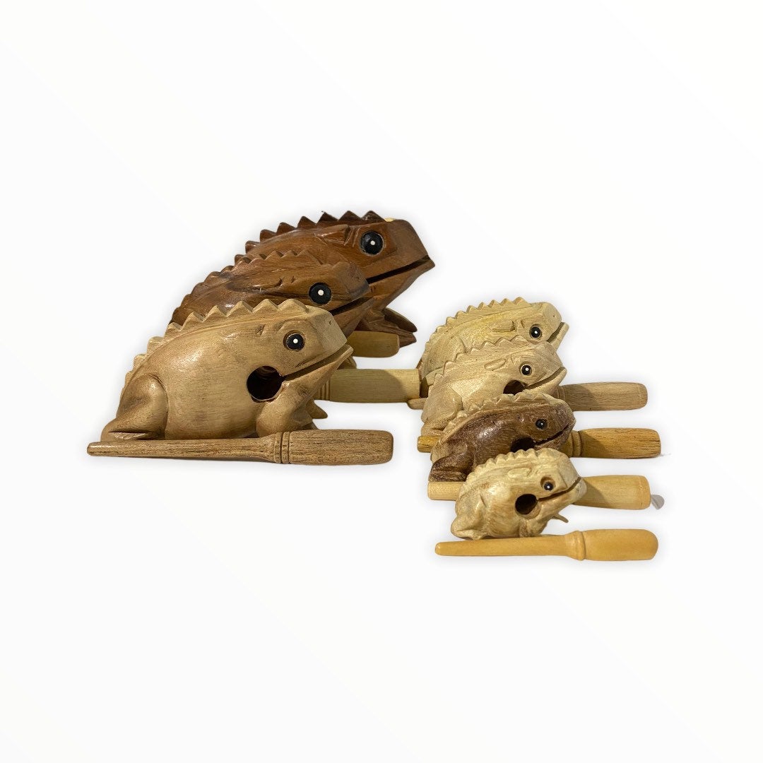 Natural wooden frog with mallet, showcasing craftsmanship and design.