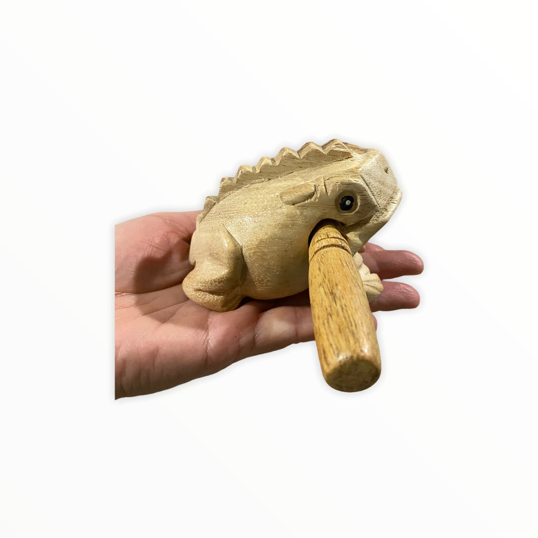 Natural wooden frog with mallet, showcasing craftsmanship and design.