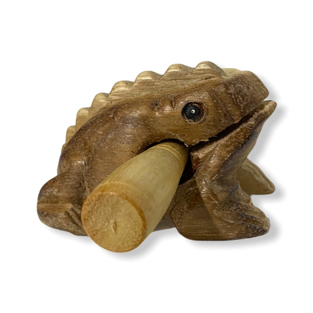 Natural wooden frog with mallet, showcasing craftsmanship and design.