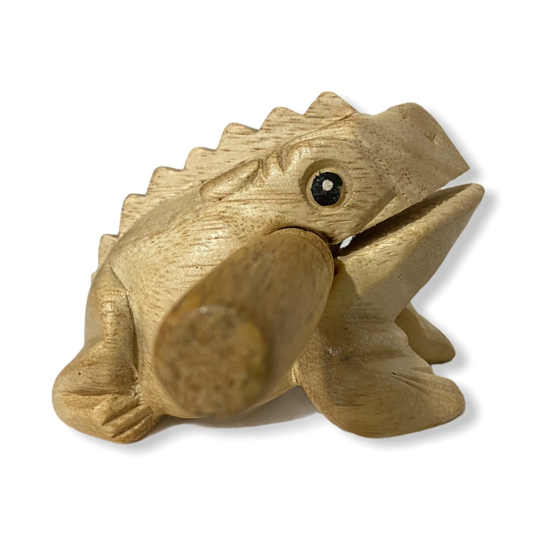 Natural wooden frog with mallet, showcasing craftsmanship and design.